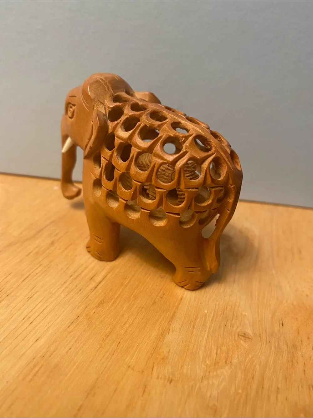 Hand-Carved Wooden Elephant Figurine in Warm Brown with baby elephant in stomach